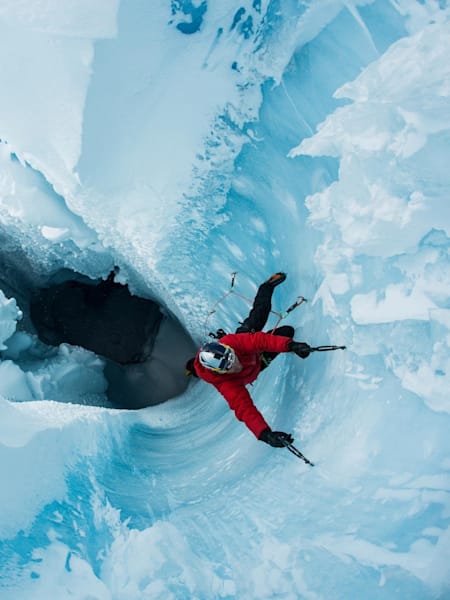 Will Gadd is pictured climbing out of a moulin during his trip to climb the Greenland ice cap in August 2018.