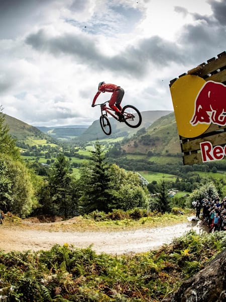A photo of Charlie Hatton jumping on his mountain bike