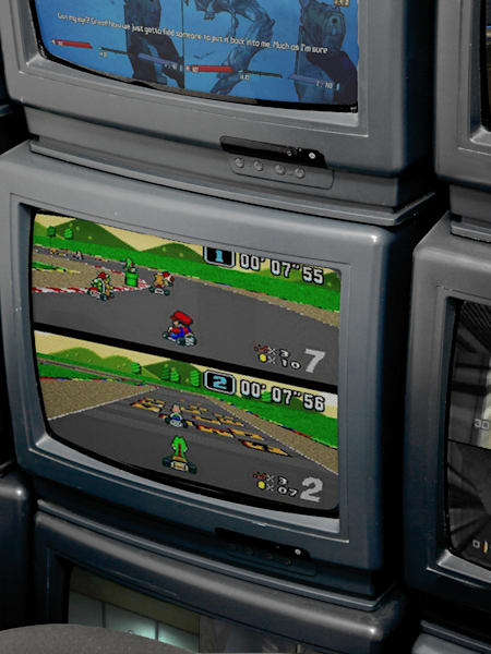 A selection of classic split screen video games displayed on old TVs