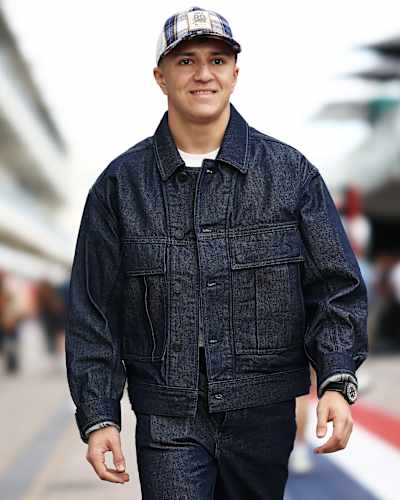 Isack Hadjar of France and Visa Cash App Racing Bulls walks in the Paddock prior to practice ahead of the F1 Grand Prix of United States at Circuit of The Americas on October 17, 2025.