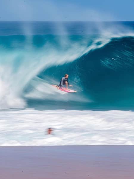 Surfer Jamie OBrien sets up for a tube at Pipeline, Oahu, Hawaii