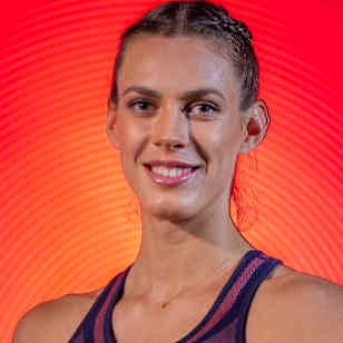 Tīna Graudiņa poses with a beach volleyball in Riga, Latvia.