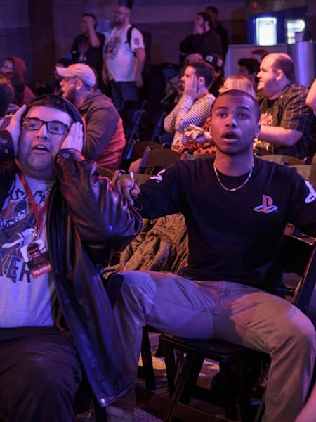 Audience members react to a beatdown.