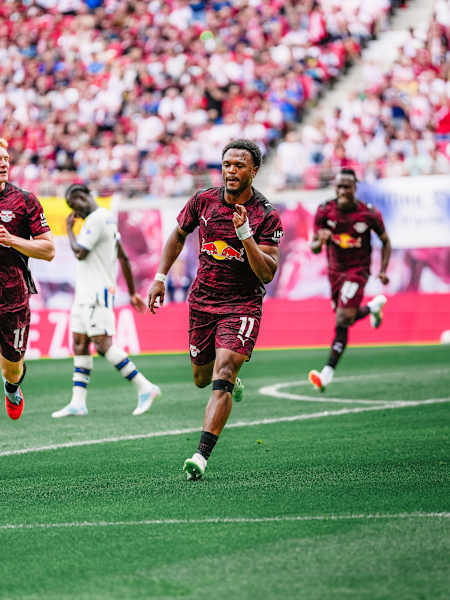 RB Leipzig players sprint across the pitch during an electrifying 2025 test match against Atalanta Bergamo in Leipzig, showcasing Red Bull's dynamic football spirit