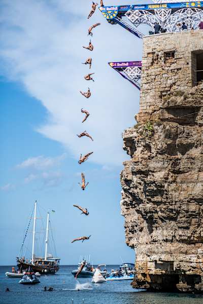 Catalin Preda of Romania dives from the 28 metre platform during the second competition day of the seventh stop of the Red Bull Cliff Diving World Series at Polignano a Mare, 2022.
