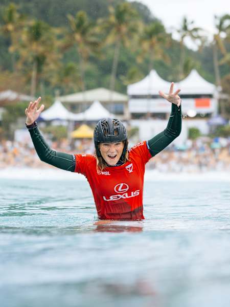 Surfer Caitlin Simmers celebrates in the water after winning the 2024 Lexus Pipe Pro.