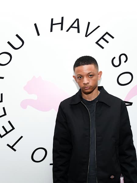 A photo of hip-hop photographer Gunner Stahl at an exhibition of his work.