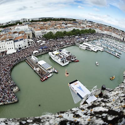 Cyrille Oumedjkane diving against the spectacular backdrop of La Rochelle
