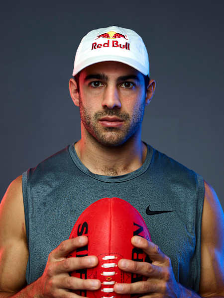 AFL superstar Christian Petracca poses with a Sherrin