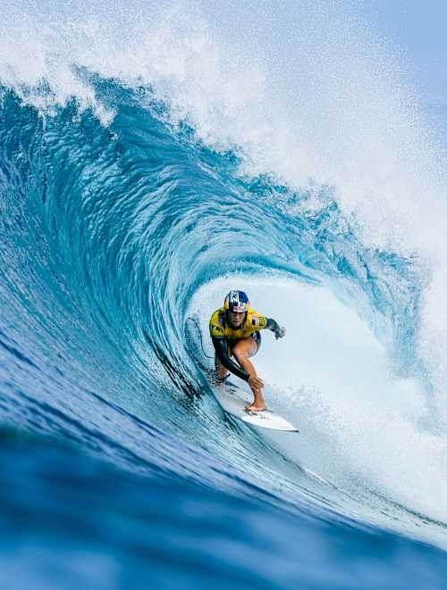 In 2025, Caitlin Simmers surfs a massive wave barrel