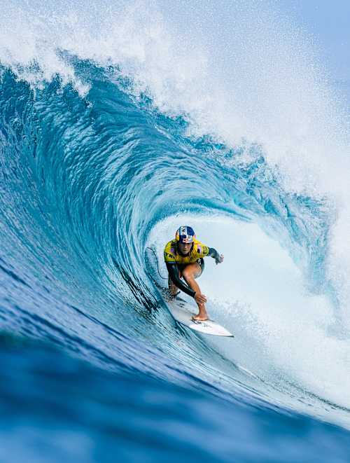 In 2025, Caitlin Simmers surfs a massive wave barrel