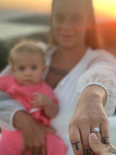 Poppin'C's private photo of the moment he proposed to his girlfriend in Sardinia.
