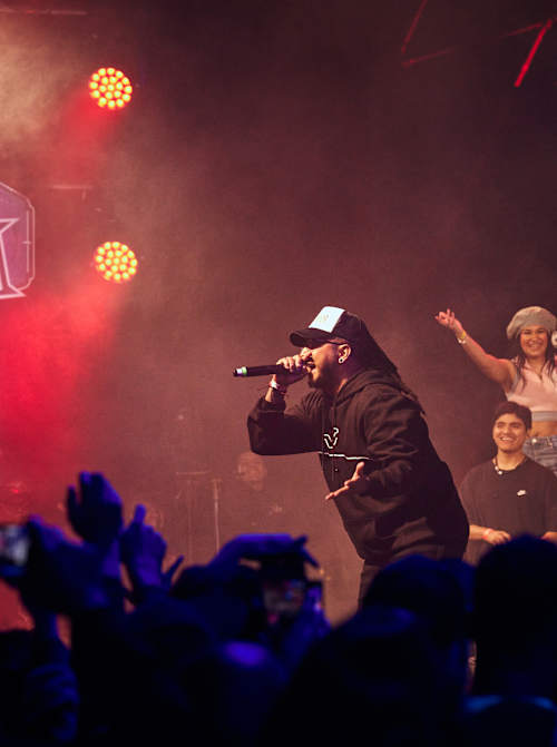 Blackcode electrifies the crowd during his dynamic performance at the Red Bull Batalla National Final in Lima, Peru, on 13 September 2025 as fans cheer him on under vibrant stage lights
