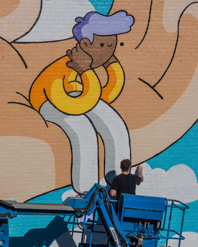 Canadian illustrator Scott Martin, aka Burnt Toast, creating a mural.