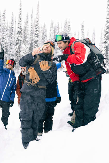 Travis Rice and Blake Moller discuss the conditions on the face at the finals of Natural Selection Tour 2025 in Revelstoke, Canada,
