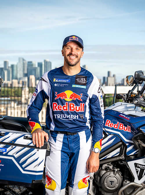 In 2026, Sam Sunderland poses with his Red Bull branded Triumph adventure motorcycle during the Around the World Record Attempt photoshoot at the Royal Observatory Greenwich in London