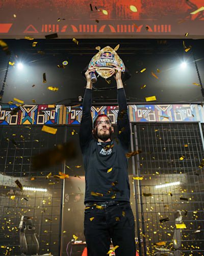 Adel 'Big Bird' Anouche lifts the trophy at Red Bull Kumite at the University of Pretoria's Rembrandt Hall, Pretoria, South Africa on July 2, 2023