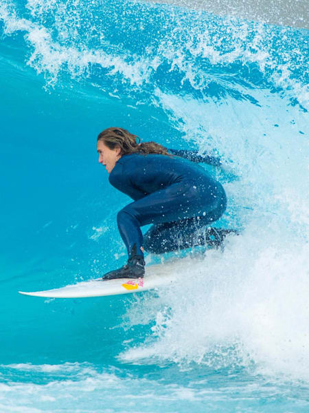 Surfer Justine Dupont rides the tube at The Wave, Bristol.