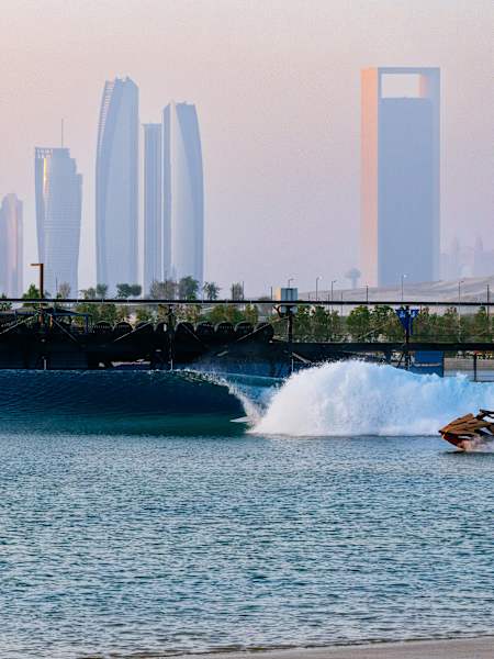 A surfer rides the tube at the Surf Abu Dhabi wave pool.