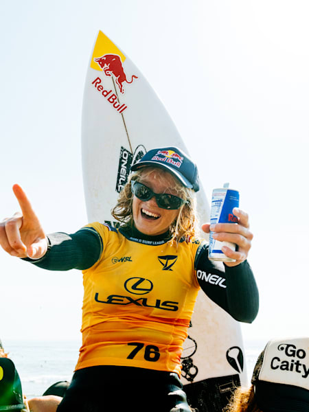 Caitlin Simmers is chaired up the beach after winning the WSL Finals at Lower Trestles.
