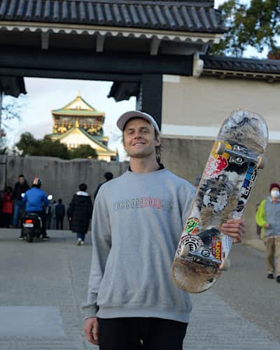 Madars Apse poses outside Osaka Castle in Japan during filming of Skate Tales.