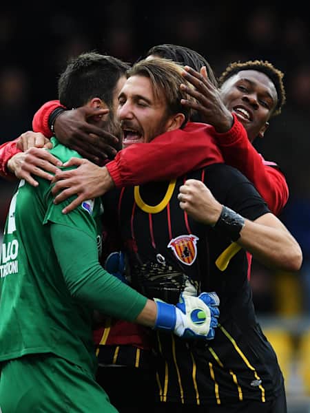 Goalkeeper Alberto Brignoli celebrates with his Benevento team-mates.