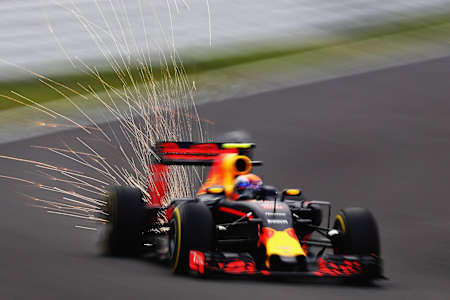 Sparks fly from a Red Bull Racing car at the F1 Japanese Grand Prix 2016