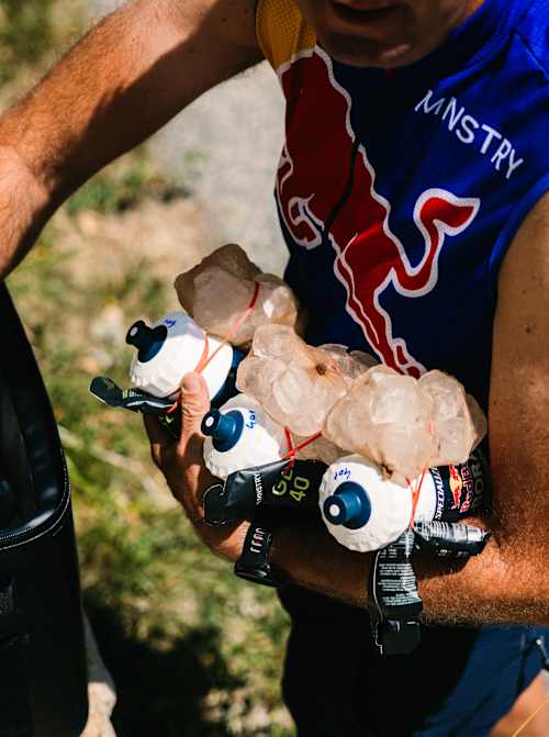 Staff of the Red Bull – BORA – hansgrohe team prepare cold drinks during Stage 18 of the 113th Tour de France. 