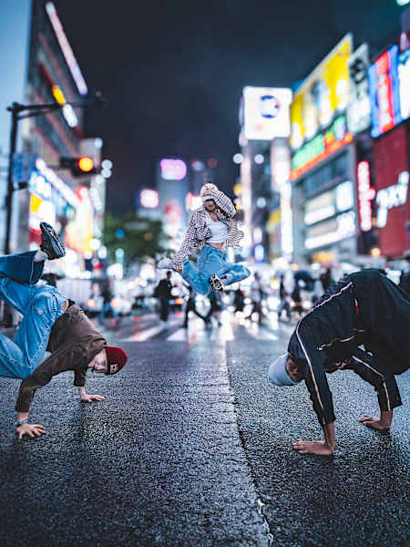 B-Girl Ami, B-Girl Nicka, and B-Boy Lee showcase dynamic moves in Shibuya, marking Red Bull BC One World Final 2025 announcement in Tokyo