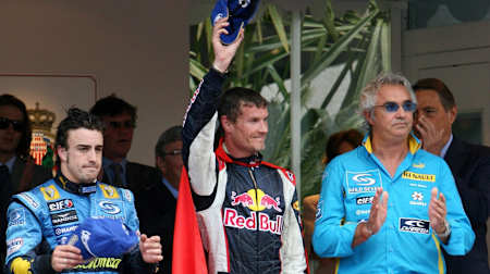 A photo of David Coulthard celebrating his third-place finish at the 2006 Monaco Grand Prix – Red Bull Racing's first ever podium finish.