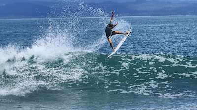 Leon Glatzer surfing at home in Costa Rica.