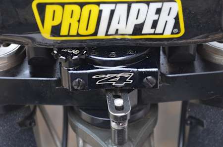 Close up of the steering damper on an FMX bike