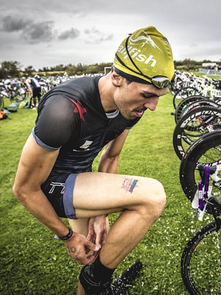 A competitor transitions during a triathlon.