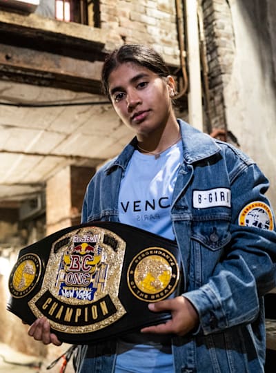 India posing with the belt from the Red Bull BC One World Final 2022 on November 12, 2022. 