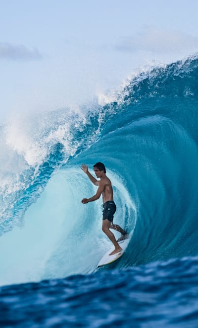 Eli Hanneman rides the tube at Teahupo'o in Tahiti on May 29, 2022.