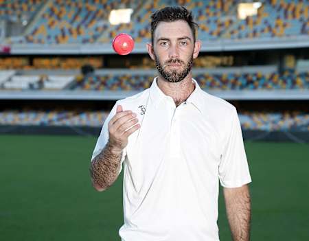 Australian cricket player Glenn Maxwell demonstrates the pink Kookaburra cricket ball.