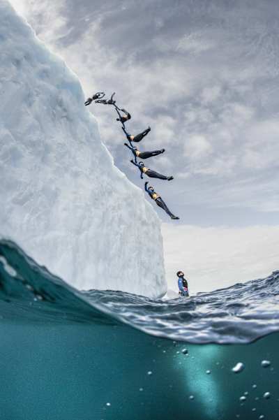 An image of cliff diver Orlando Duque diving off an iceberg in the Antarctic. 