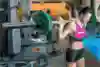 A woman lifts weights in the gym