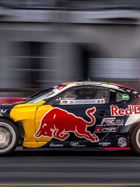 Conor Shanahan unleashes his Red Bull drift car with flames erupting during Round 3 of the 2025 Drift Masters European Championship in Alahärmä, Finland.