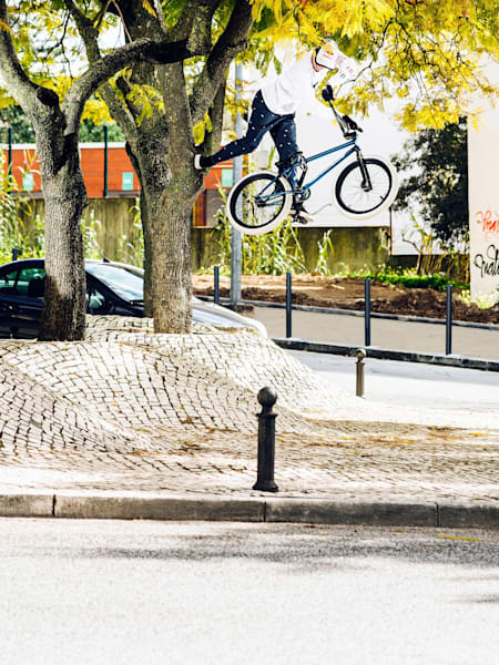 Kriss Kyle does a footplant off a tree in Lisbon, Portugal.