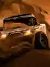 A truck rides over sand dunes at the Dakar Rally.