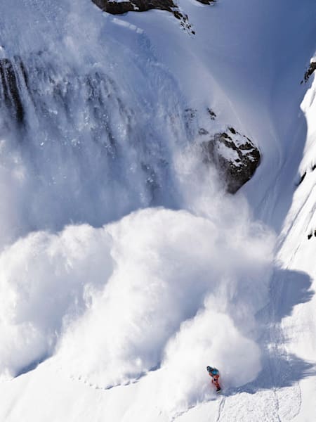 Snowboarder Xavier De Le Rue riding the back country in Engelberg, Switzerland