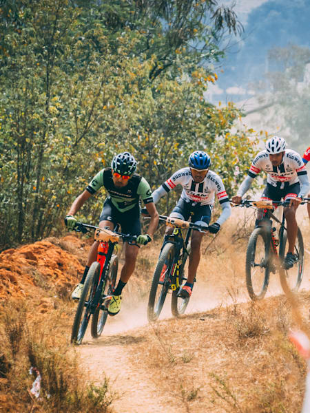 MTB riders participate in a cross-country Olympic event at Bangalore Mountain Festival.