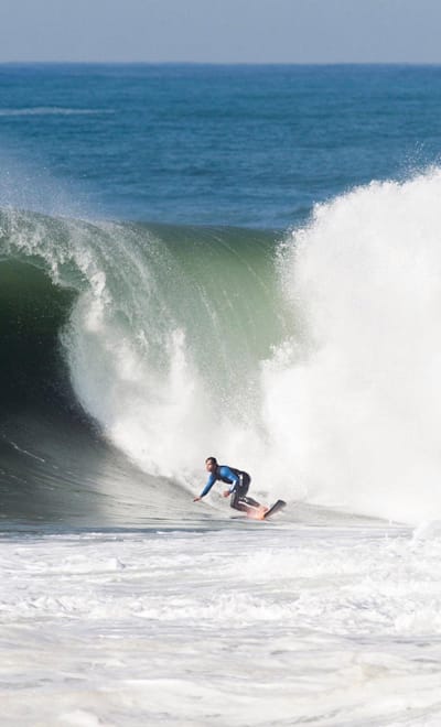 Carlos Burle returned with Maya Gabeira to the beach where he saved Maya's life back in 2013. Here seen in action in the sea.
