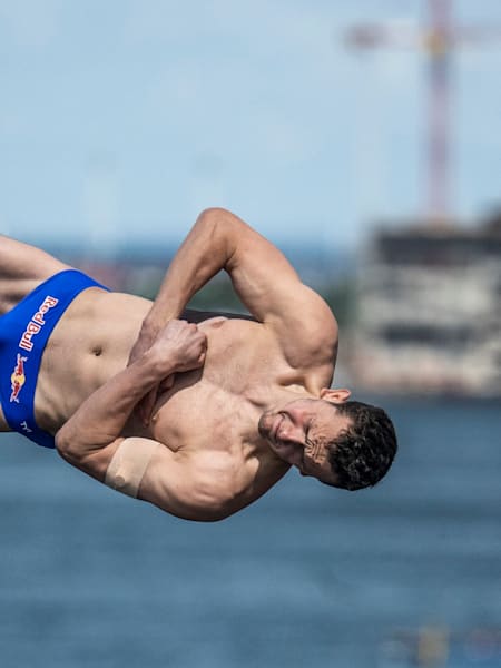 Aidan Heslop of the UK dives from the 28m platform during the final competition day of the third stop of the Red Bull Cliff Diving World Series at Copenhagen, Denmark, on July 16, 2022.