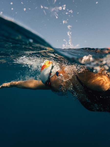 Nathalie Pohl powers through the deep blue waters off Ibiza in 2025.