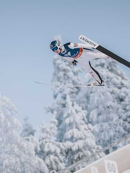 In 2023, Daniel Tschofenig soars through Ruka's snowy skies.