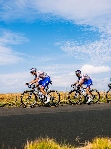 On July 14, 2025, Florian Lipowitz and Primož Roglič of Team Red Bull - BORA - hansgrohe are captured racing through France in Stage 10 of Le Mont-Dore Puy de Sancy, Tour de France