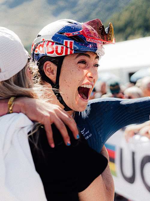 Kate Courtney celebrates winning the UCI MTB World Championships in Valais, Switzerland on Septemeber 6, 2025.