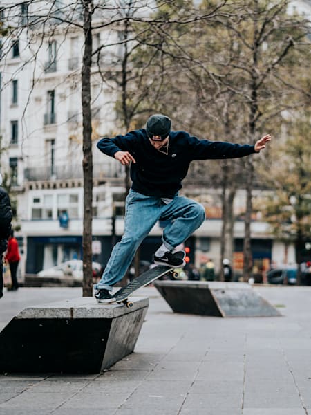 Tim Debauche performs a crooked grind in Paris, France 